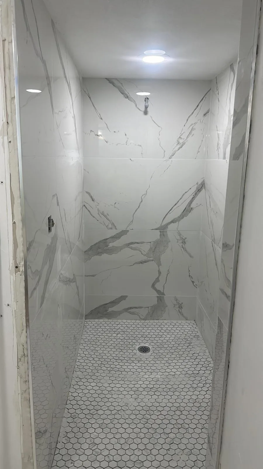 Finished marble tile shower after remodel — D&Co Homes, Palm Beach County